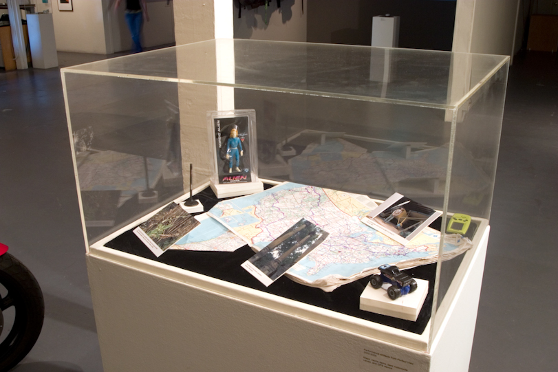 Photo: Vitrine containing the treausures attained at geocache sites.