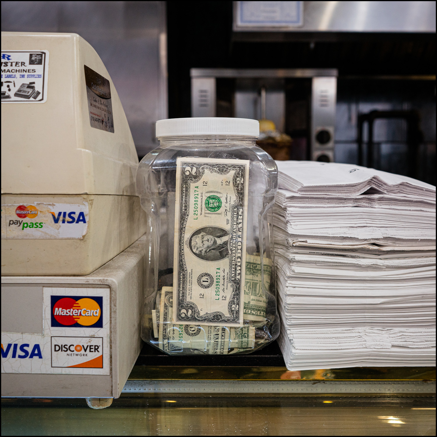 Photograph: plastic jar used as a tip jar