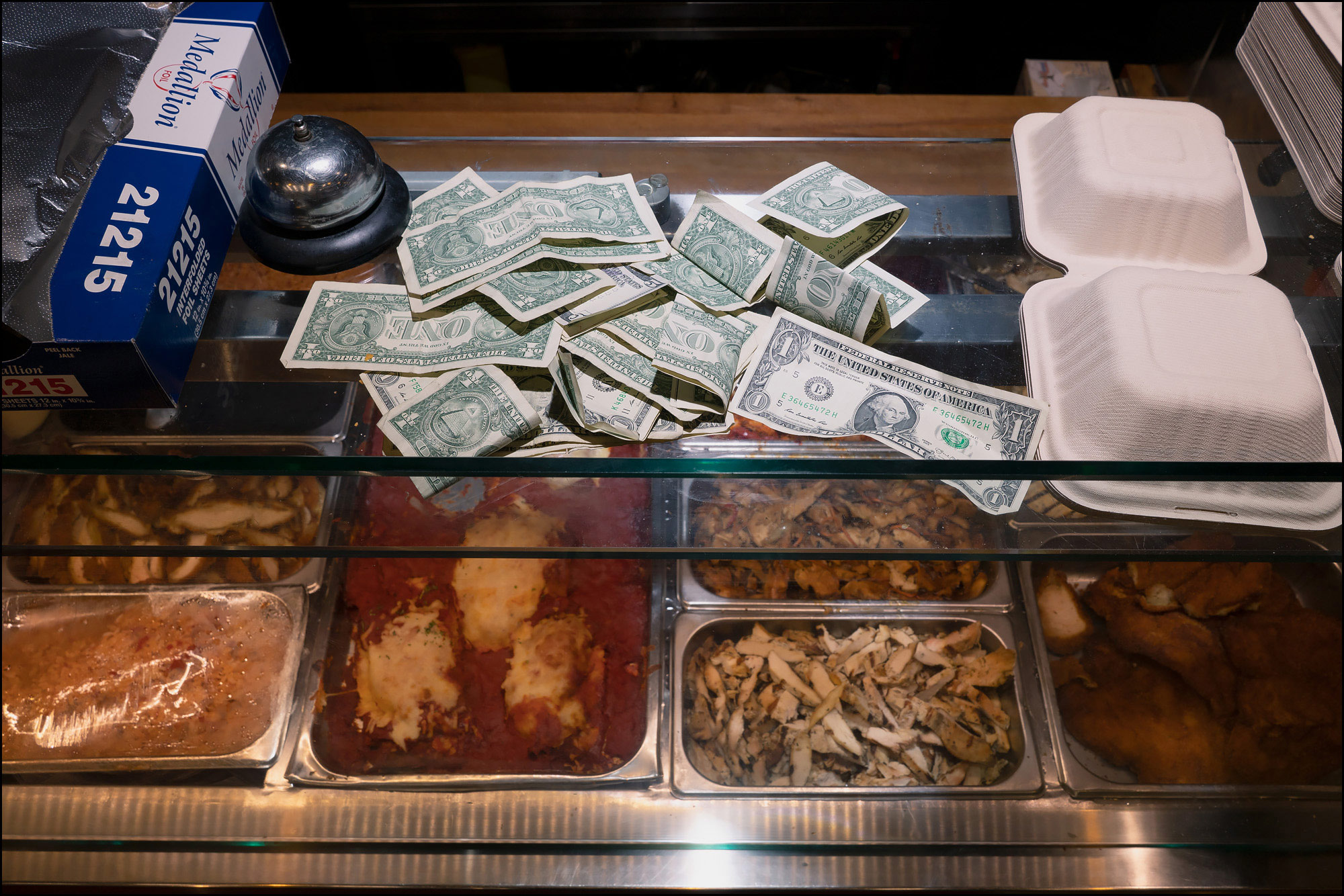 Photo: tips loosely sitting on glass counter